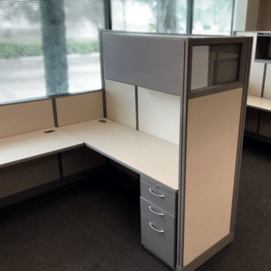 This is a picture of a used desk cubicle.