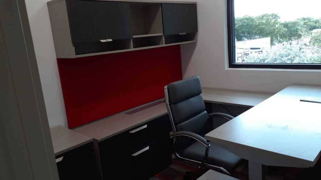 Construction office in south florida with desk, chair and shelving